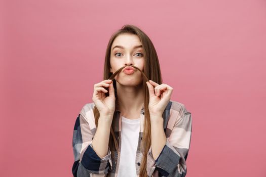 Portrait of crazy adorable young woman playing with her hairs. emotional girl isolated on white background.