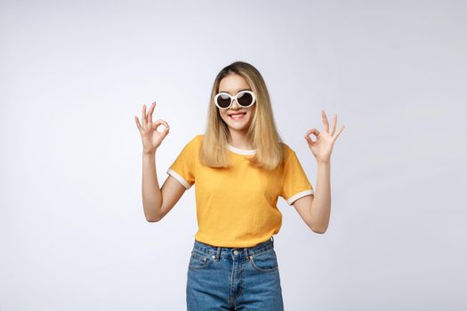 Asian young woman beautiful smile with ok finger sign isolate on white background.