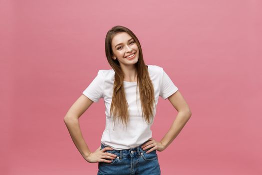 Surprised happy beautiful woman looking in excitement. Isolate over pink background and copy space