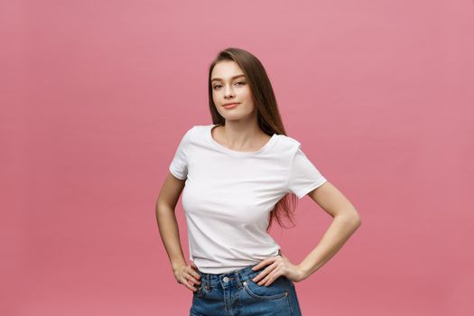 Surprised happy beautiful woman looking in excitement. Isolate over pink background and copy space