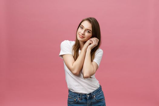 Surprised happy beautiful woman looking in excitement. Isolate over pink background and copy space