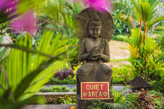 A sign QUIET AREA in a quiet corner of the garden.