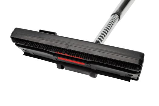 black vacuum cleaner brush with silver pipe isolated on white background, close-up with selective focus