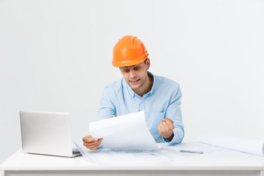 Handsome young man serious working in engineering office