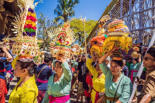 Ubud, Bali, Indonesia - April 22, 2019 : Royal cremation ceremony prepation. Balinese hindus religion procession. Bade and Lembu Black Bull symbol of transportation for the spirit to the heaven.