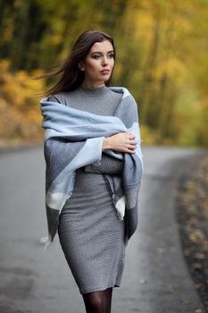 Autumn woman portrait smiling outdoors at the park