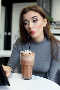 Smiling Woman with Coffee Frappe Drink at the Restaurant - Portrait of a beautiful girl with frappuccino