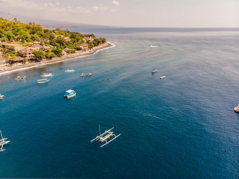 Jemeluk Bay, Amed. Amed is fast becoming a popular tourist destination in Bali, Indonesia. Set in the North-East of Bali, it is a home to excellent snorkeling, scuba diving, freediving and yoga.