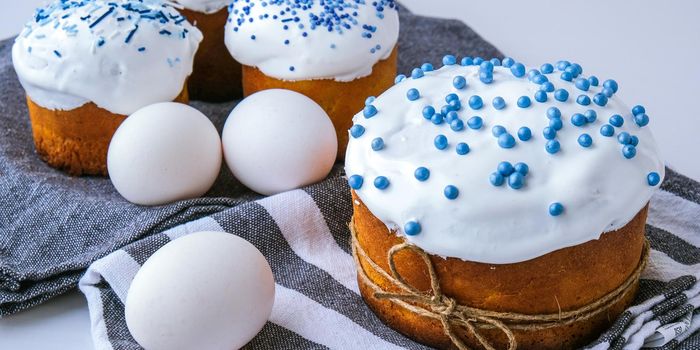 Happy Day Bright Easter. Orthodox Easter holiday. Traditional food. Creative stylish trend Homemade easter cake and eggs. Selective focus. Kulich Festive easter background Minimalism