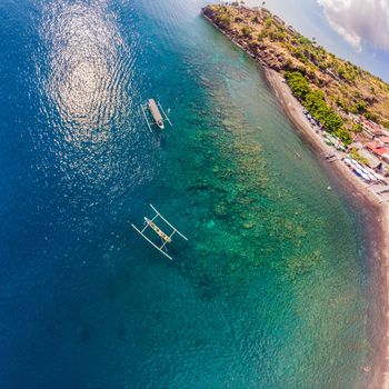 Jemeluk Bay, Amed. Amed is fast becoming a popular tourist destination in Bali, Indonesia. Set in the North-East of Bali, it is a home to excellent snorkeling, scuba diving, freediving and yoga.