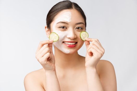 Beauty young asian women skin care image with cucumber on white background studio.