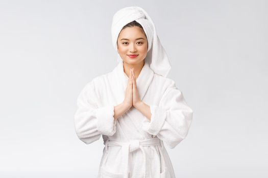 Beautiful women take care of skin health holding hand praying. Beautiful girl on white background