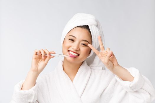 Close up of Smile woman brush teeth. great for health dental care concept, Isolated over white background. asian