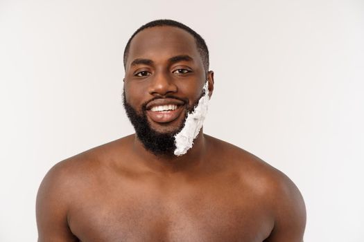 Young Afro American Man Shaving in Bathroom. Personal Morning Routine. Hygiene at Morning Concept