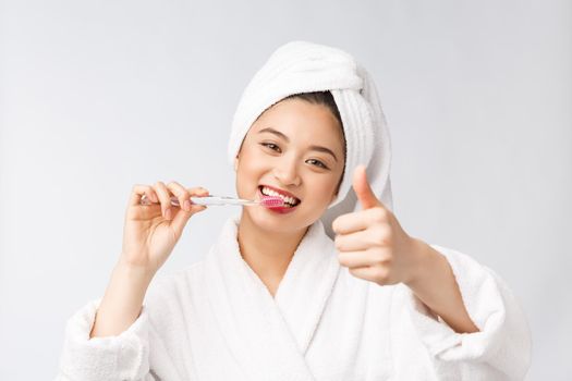 Close up of Smile woman brush teeth. great for health dental care concept, Isolated over white background. asian