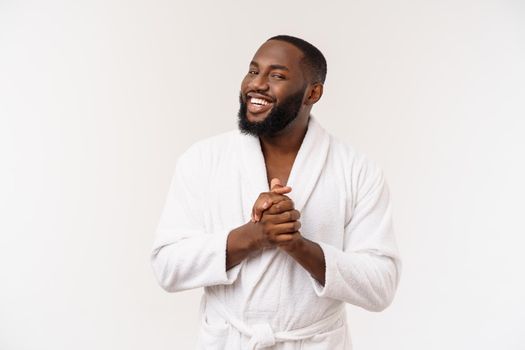 African American man wearing a bathrobe with surprise and happy emotion. Isolated over whtie background.