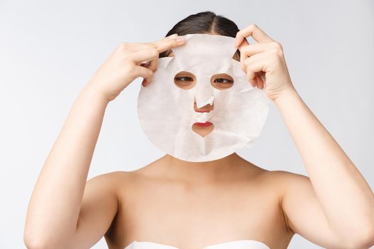 Spa, healthcare. Woman with purifying mask on her face isolated on white background