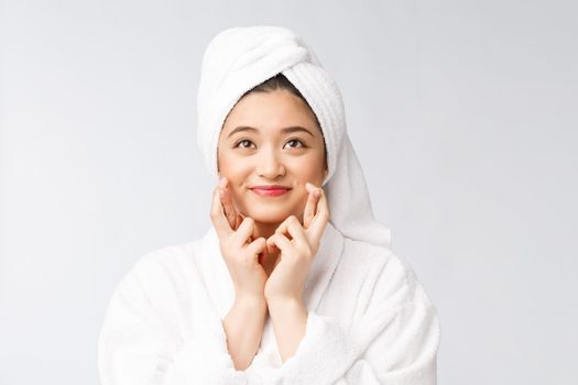 Spa skincare beauty Asian woman drying hair with towel on head after shower treatment. Beautiful multiracial young girl touching soft skin.