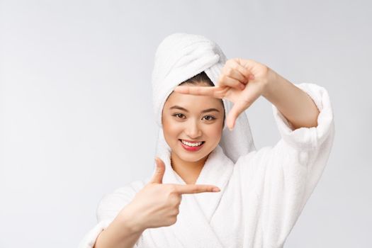 Beautiful Woman face and she making frame with hands with health skin, concept for skin care , asian beauty