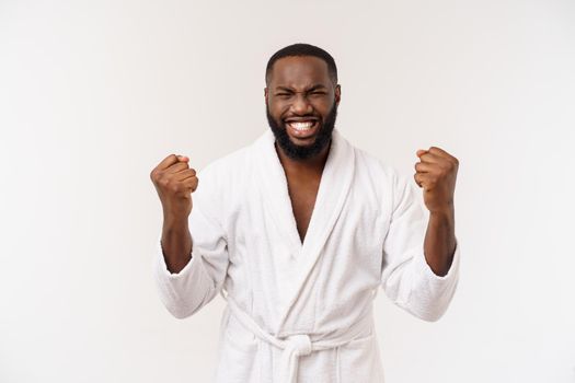 Young african american man wearing bathrobe over isolated white background thinking looking tired and bored with depression problems