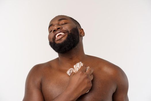 An african-american prepare for taking a shower, isolated on white background.