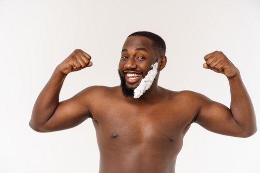 Young Afro American Man Shaving in Bathroom. Personal Morning Routine. Hygiene at Morning Concept