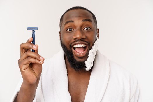 Young Afro American Man Shaving in Bathroom. Personal Morning Routine. Hygiene at Morning Concept