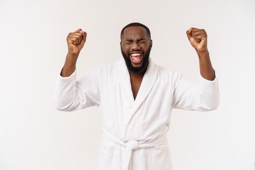 Portrait of excited young African American male screaming in shock and amazement holding hands on head. Surprised black man looking impressed.