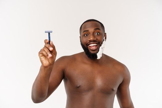 Young Afro American Man Shaving in Bathroom. Personal Morning Routine. Hygiene at Morning Concept