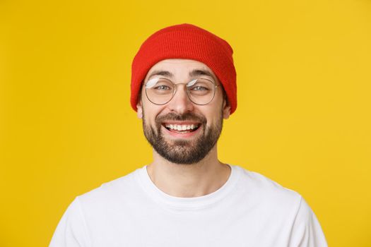 Young casual man portrait isolated on yellow background.