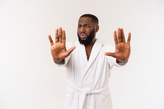 Portrait shock and annoyed displeased young man raising hands up to say no stop right there isolated grey background