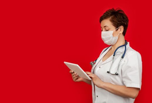 Portrait of a female doctor using her digital tablet. Female doctor using tablet and checking with analysis on a virtual interface. Medicine. Medical science and biotechnology.