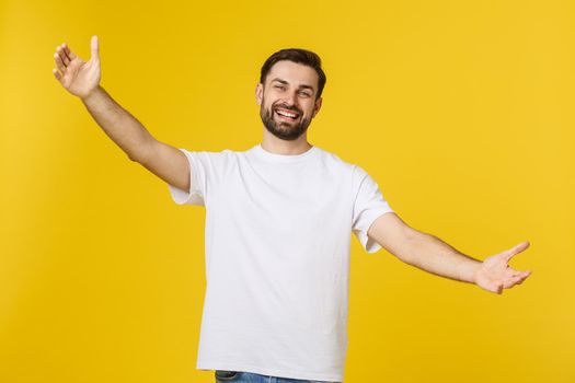 Young handsome cool man feels confident giving a hug to the camera