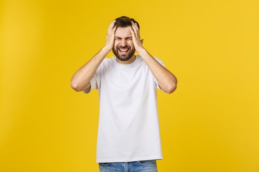 Adult hispanic man over isolated background depressed and worry for distress, angry and afraid. Sad expression.