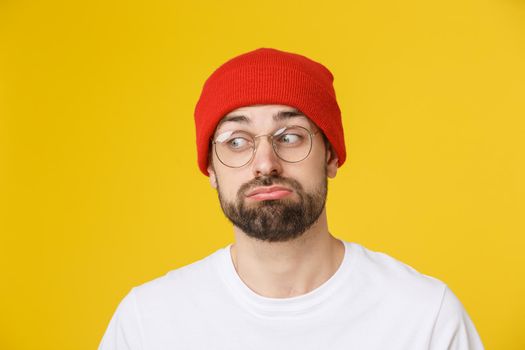 Adult hispanic man over isolated background depressed and worry for distress, angry and afraid. Sad expression.