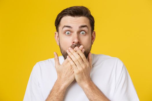 young bearded man looking amazed in to the camera.