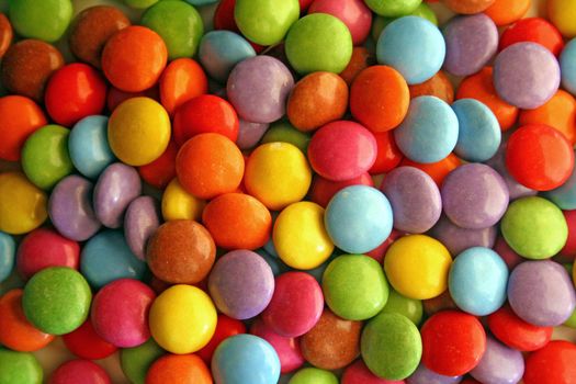 Many colored round candies background