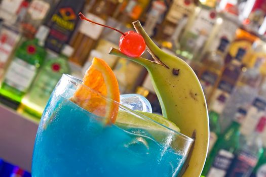 Blue cocktail with dolphin decoration