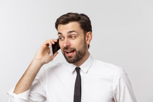 Young handsome business man calling using smartphone over isolated background with a happy face standing and smiling with a confident smile showing teeth