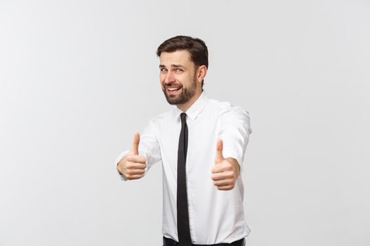 Happy smiling young business man with thumbs up gesture, isolated over white background.