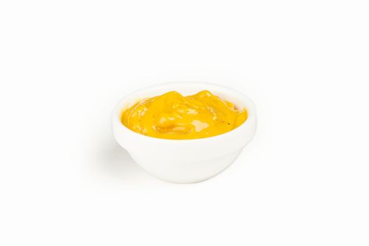 Mustard sauce in a bowl on a white plate. For the restaurant menu. Traditional Japanese sushi seasoning. Healthy eating
