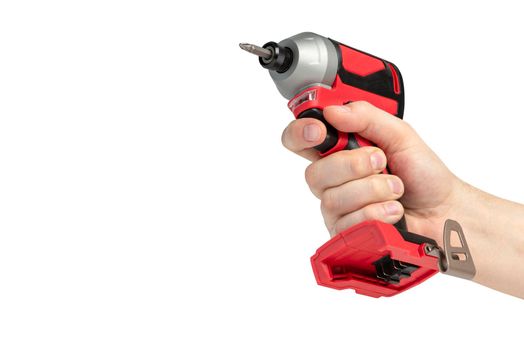 Drill in hand on a white isolated background. Cordless drill or screwdriver in a male hand. Removable lithium battery casts a shadow. The concept of selling and using cordless tools