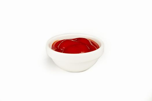 Red delicious ketchup or tomato sauce in a bowl on a white background. For the restaurant menu. Traditional Japanese sushi seasoning. Healthy eating