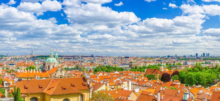 Panorama of Prague historical city centre with dome of Saint Nicholas catholic Church, red tiled roof buildings in Mala Strana Lesser Town and Old Town, aerial panoramic view, Bohemia, Czech Republic