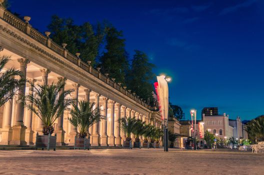 The Mill Colonnade Mlynska kolonada Neo-Renaissance building with columns and hot springs in spa town Karlovy Vary Carlsbad historical city centre, night evening view, West Bohemia, Czech Republic