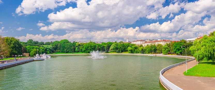 Panorama of Minsk cityscape with Svislach Svislac river embankment, Janka Kupala Park and General Headquarters building in historical centre, blue sky white clouds in sunny day, Republic of Belarus