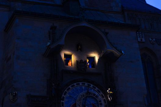 Closeup Prague Astronomical Clock Orloj with small figures located at the medieval Old Town Hall building in Old Town of Prague historical center, evening Prague chimes with figures of 12 apostles