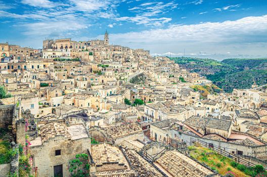 Aerial panoramic view of Matera historical centre Sasso Caveoso of old ancient town Sassi di Matera with rock cave houses and stone buildings, UNESCO World Heritage Site, Basilicata, Southern Italy