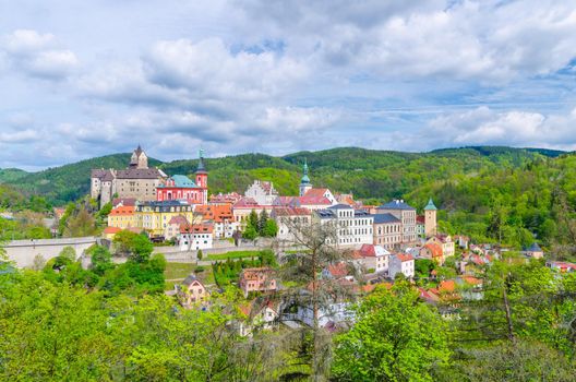 Aerial panoramic view of medieval Loket town with Loket Castle Hrad Loket gothic style on massive rock, colorful buildings, bridge over Eger river, Karlovy Vary Region, West Bohemia, Czech Republic