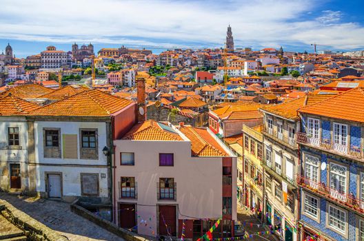 Aerial panoramic view of Porto Oporto city historical centre with red tiled roofs, typical traditional buildings, Norte or Northern Portugal. Porto cityscape